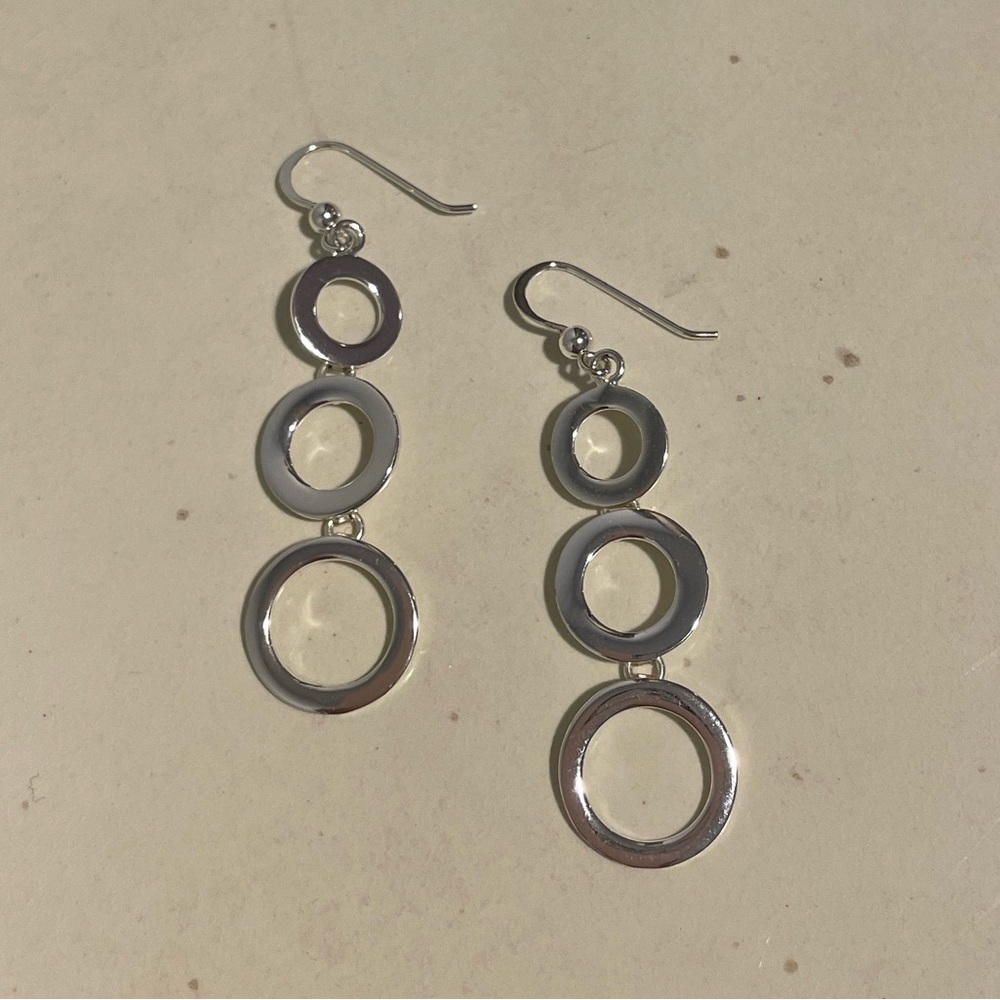 Silver earrings, dangling circles, one size.